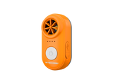 A compact handheld electronic whistle in orange, featuring a circular fan grille, four indicator lights, a large power button, and a USB-C port on a plain white background.