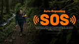 A woman hiking on a forest trail wearing a black puffer jacket with a visible orange and black SOS distress signal device. Large orange text on the right reads 'Auto-Repeating SOS' with signal wave graphics and product description text below.